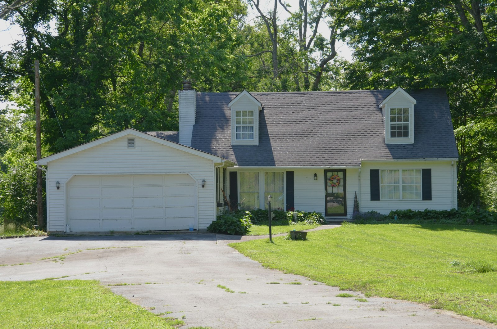 Older home with an attached two-car garage